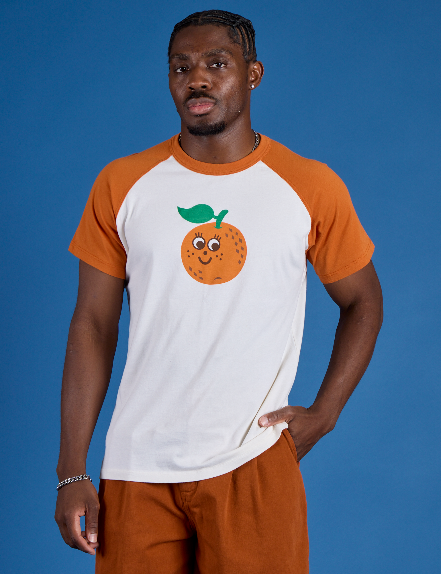 Issac is 5’10” and wearing M Produce Raglan Tee in Orange