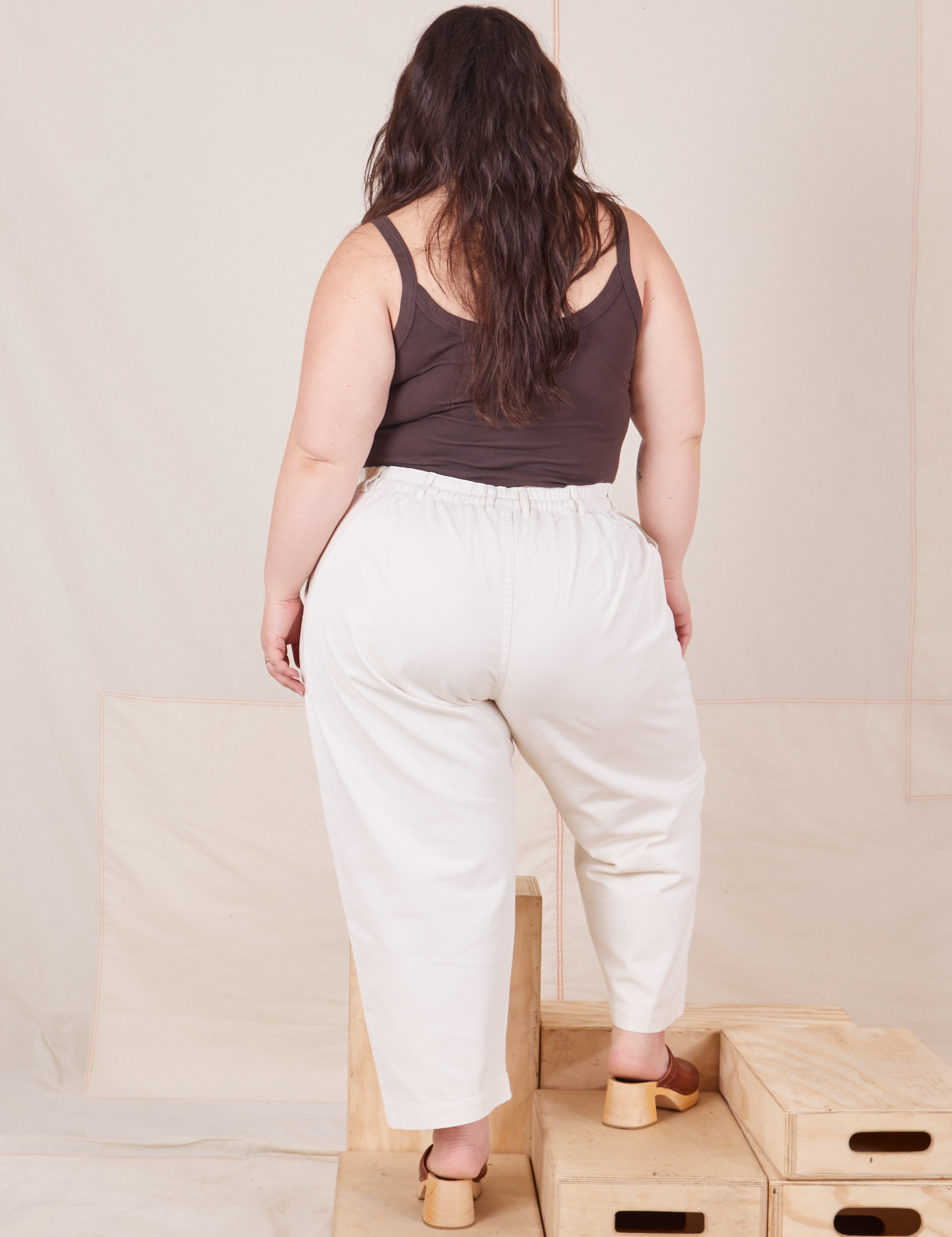 Back view of Heavyweight Trousers in Vintage Tee Off-White and espresso brown Cropped Cami worn by Ashley.