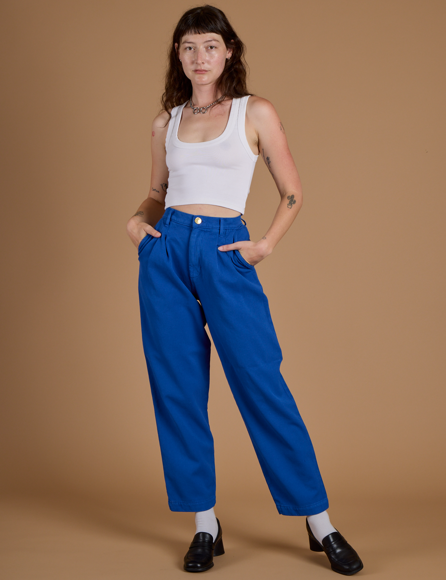 Alex is 5’8” and wearing XXS Heritage Trousers in Royal Blue