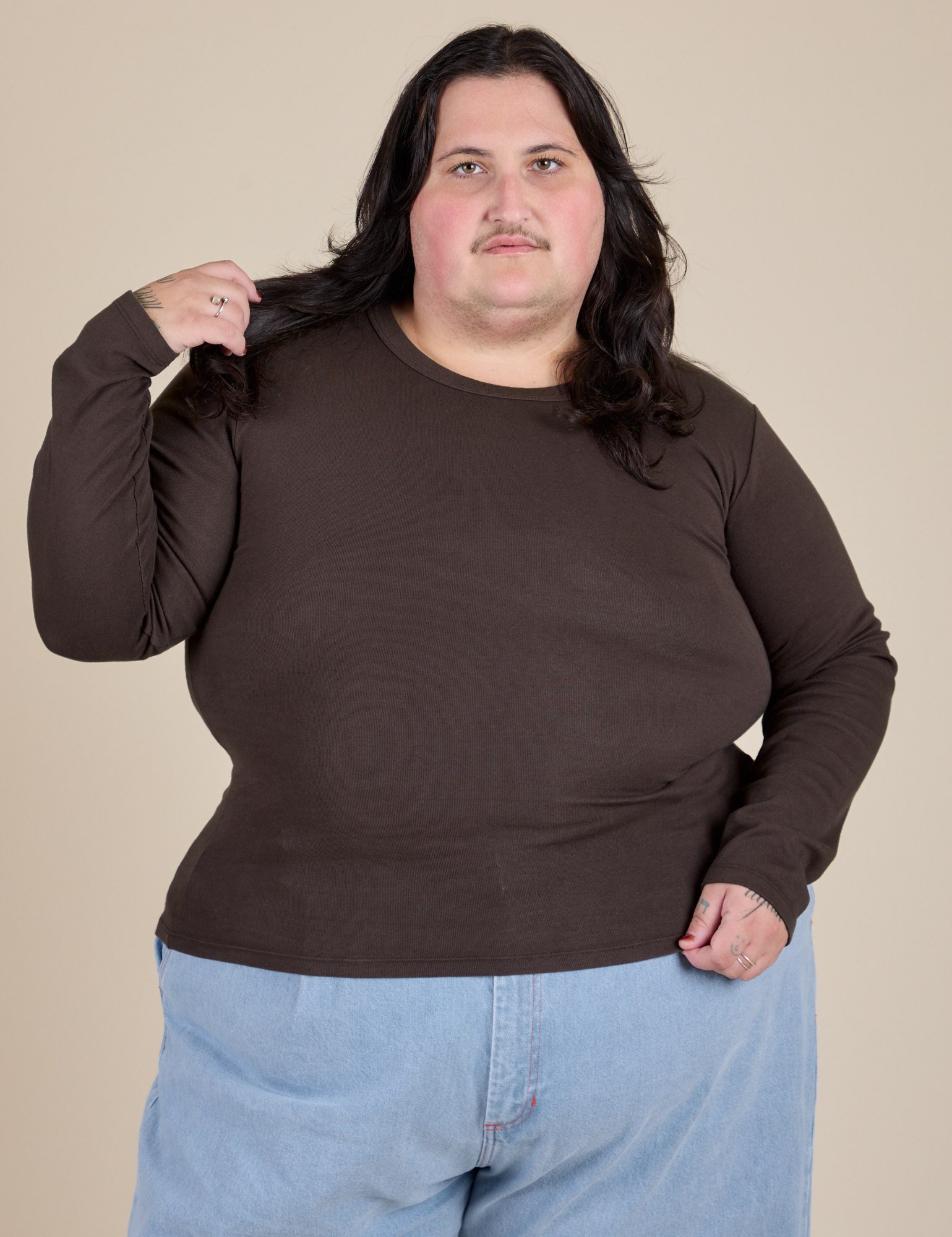 Sam is 5’10” and wearing XL Long Sleeve Baby Tee in Espresso Brown