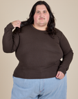 Sam is 5’10” and wearing XL Long Sleeve Baby Tee in Espresso Brown