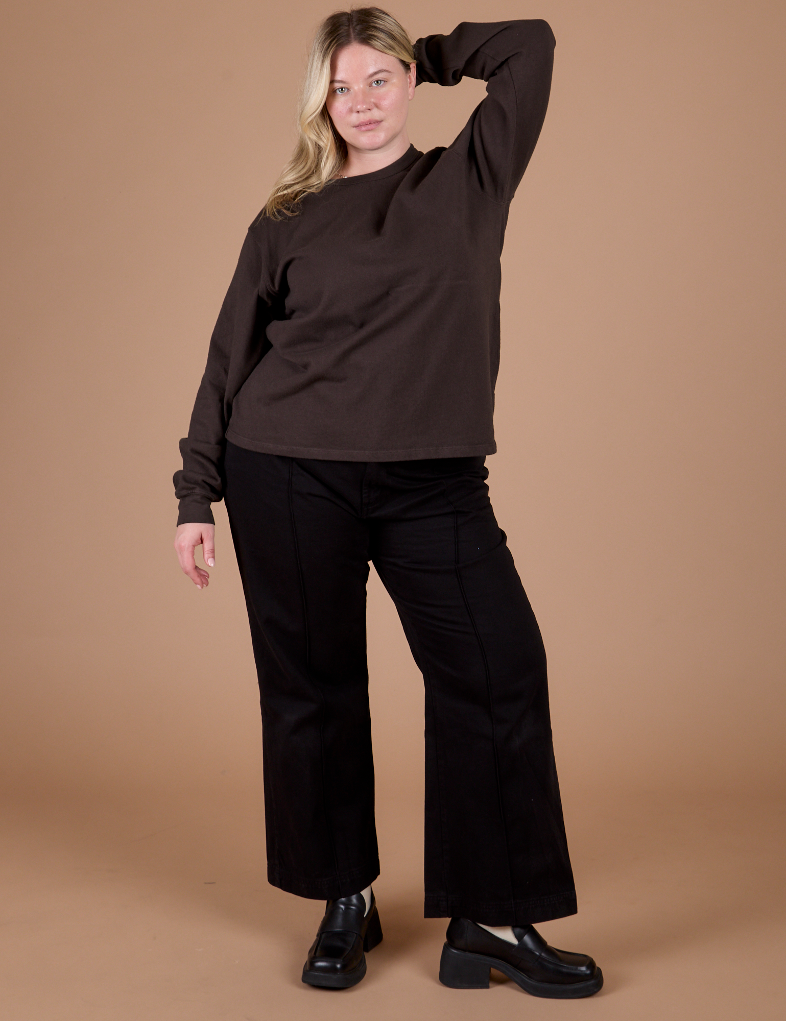 Lish is wearing Long Sleeve Burly Tee in Espresso Brown and black Western Pants