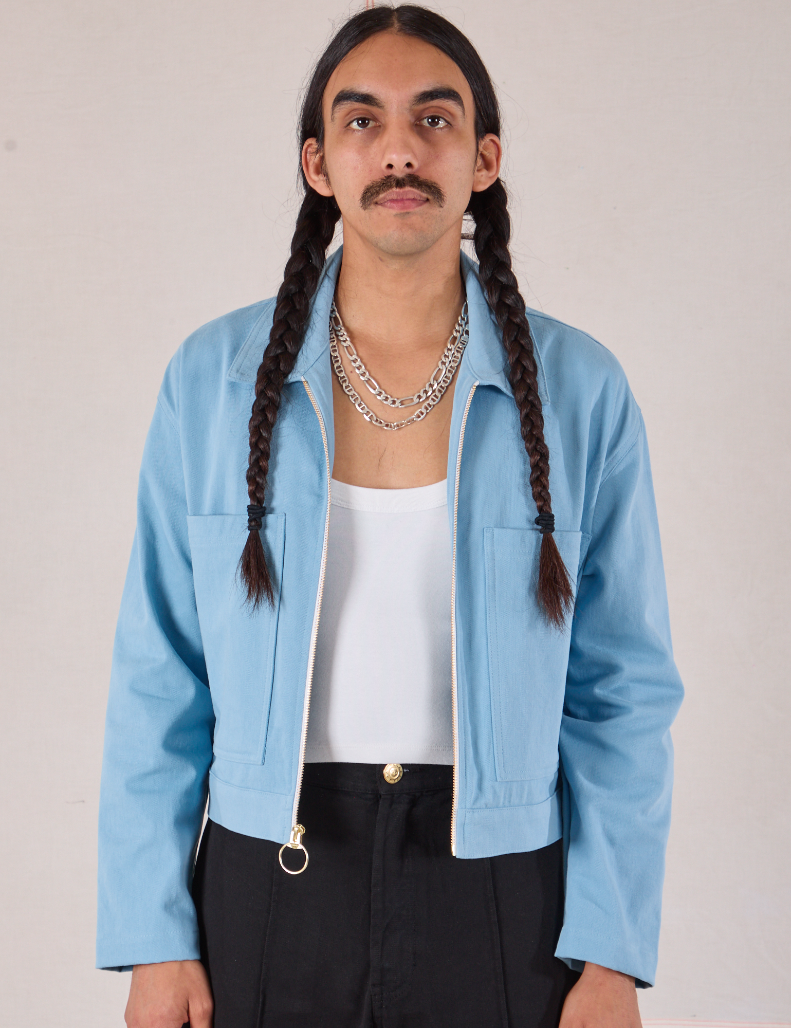 Anthony is 5’10 and wearing S Mechanic Jacket in Baby Blue