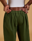 Baggy Mid-Rise Trousers in Evergreen back close up on Jerrod