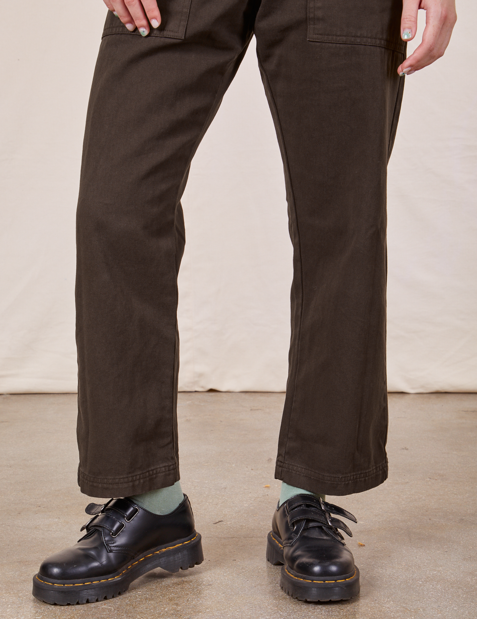 Pant leg close up of Petite Short Sleeve Jumpsuit in Espresso Brown worn by Hana