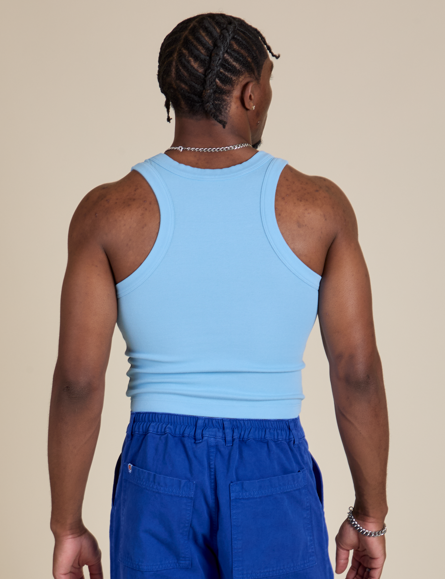 Racerback Tank in Baby Blue back view on Isaac