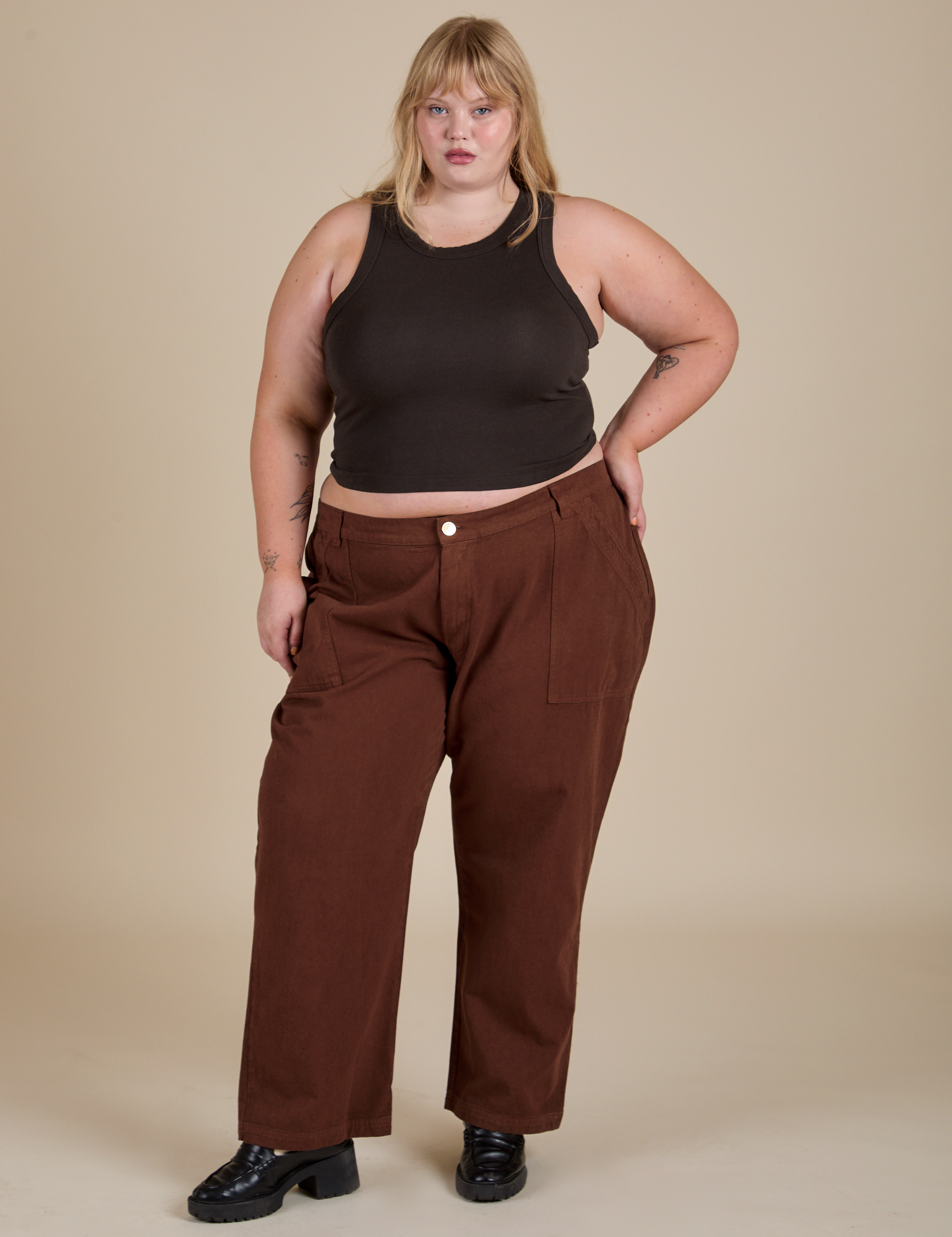 Juliet is wearing Racerback Tank in Espresso Brown and fudgesicle brown Work Pants