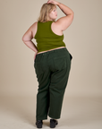 Racerback Tank in Summer Olive and swamp green Work Pants back view on Juliet