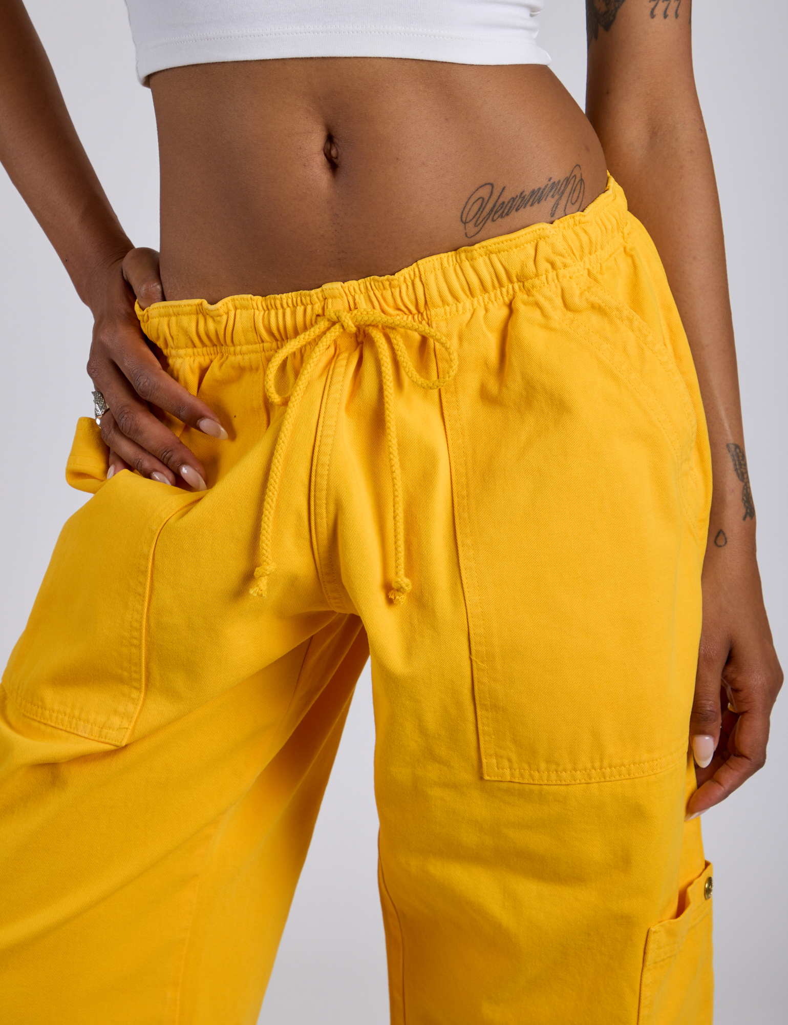 Close up of Drop Pocket Cargo Pants in Sunshine Yellow on Kira