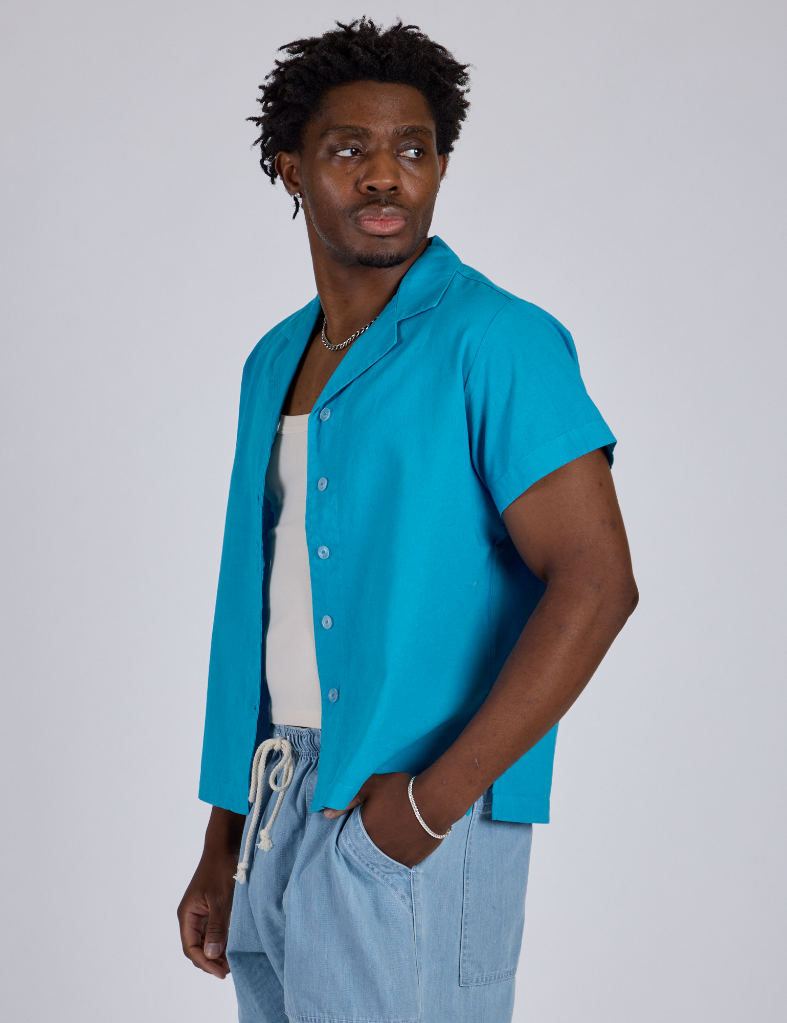 Angled front view of Pantry Button-Up in Hawaiian Blue on Isaac