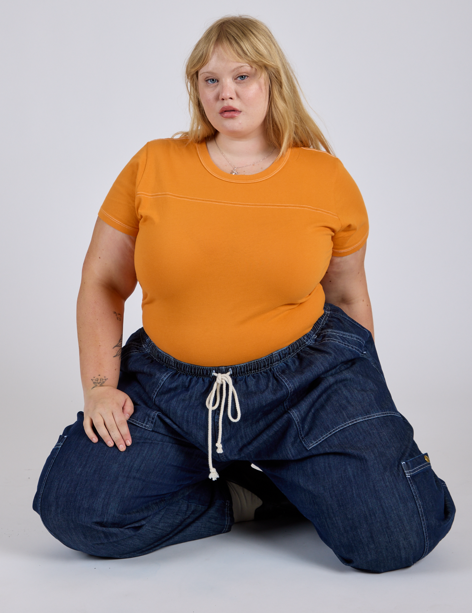 Jr. Varsity Tee in Creamsicle Orange and dark wash Denim Drop Pocket Pants on Juliet