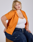Pantry Button-Up in Creamsicle Orange worn by Juliet
