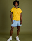 Jerrod is wearing Vintage Ringer Tee in Sunshine Yellow and light wash Carpenter Shorts