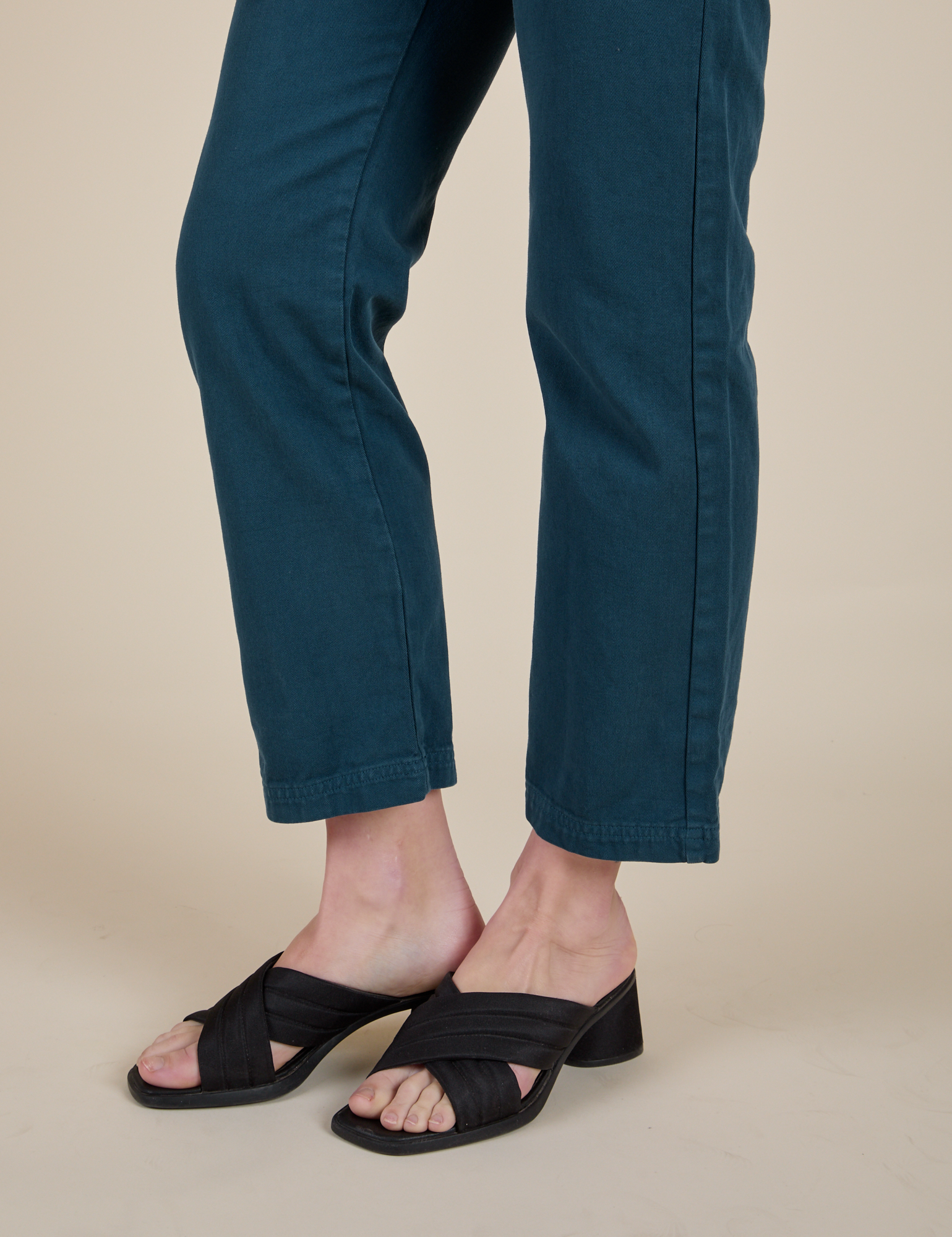 Short Sleeve Jumpsuit in Lagoon pant leg close up on Alex