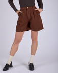 Front close up of Pleated Trouser Shorts in Fudgesicle Brown on Alex