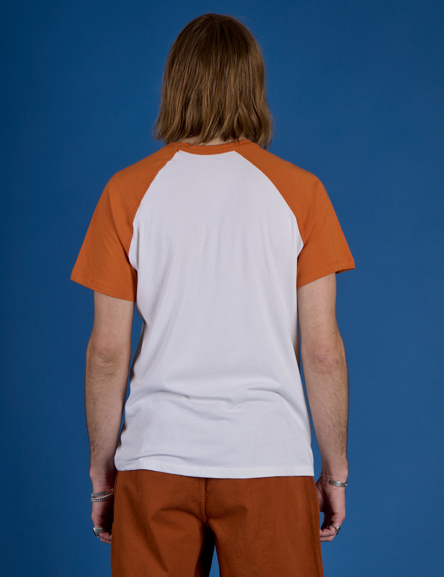 Back view of Produce Raglan Tee in Habanero on Grant