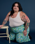 Sam is wearing Winter Floral Print Work Pants and vintage tee off-white Tank Top