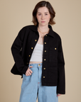 Hana is 5'3" and wearing P Work Jacket in Basic Black