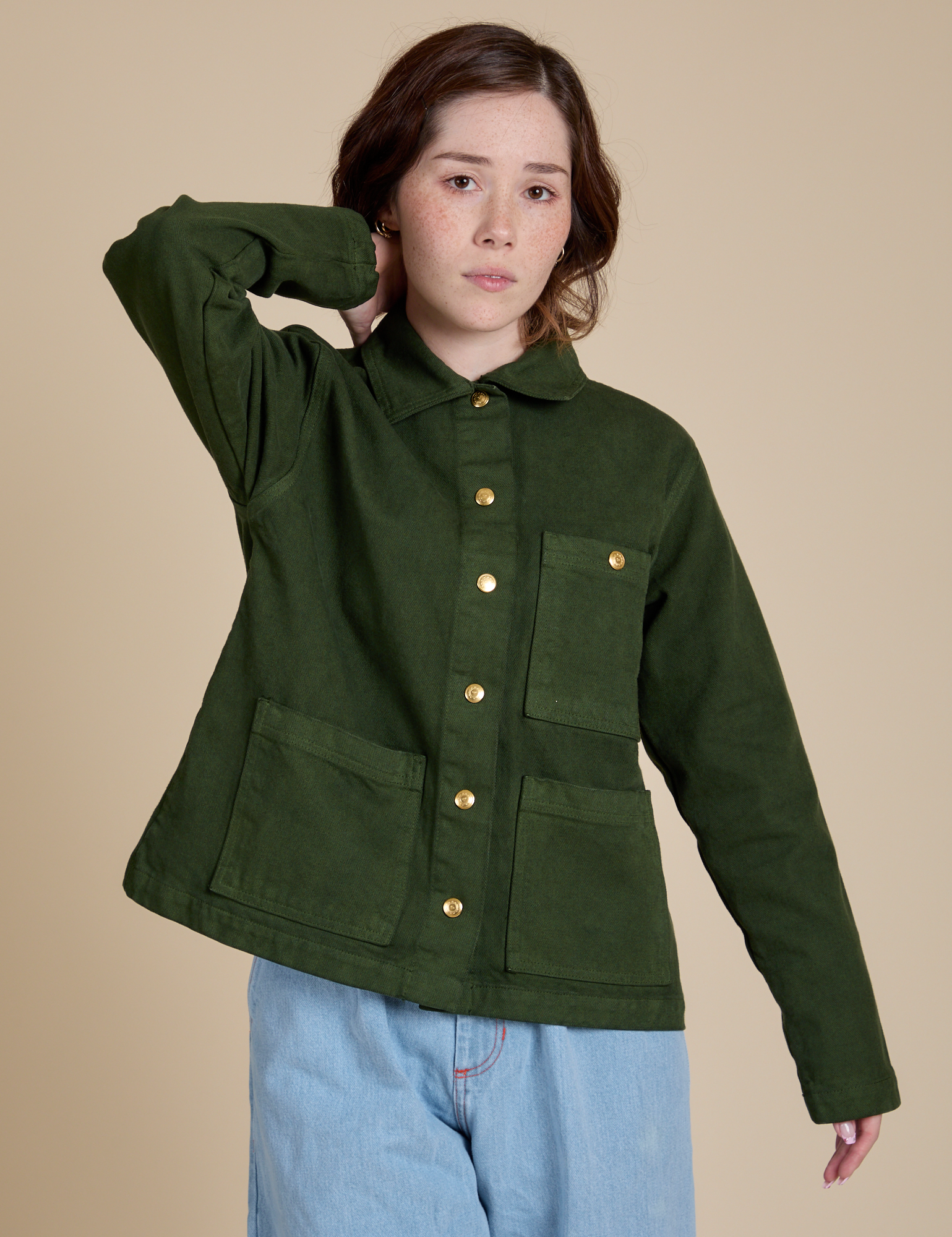 Hana is 5'3" and wearing P Denim Work Jacket in Evergreen