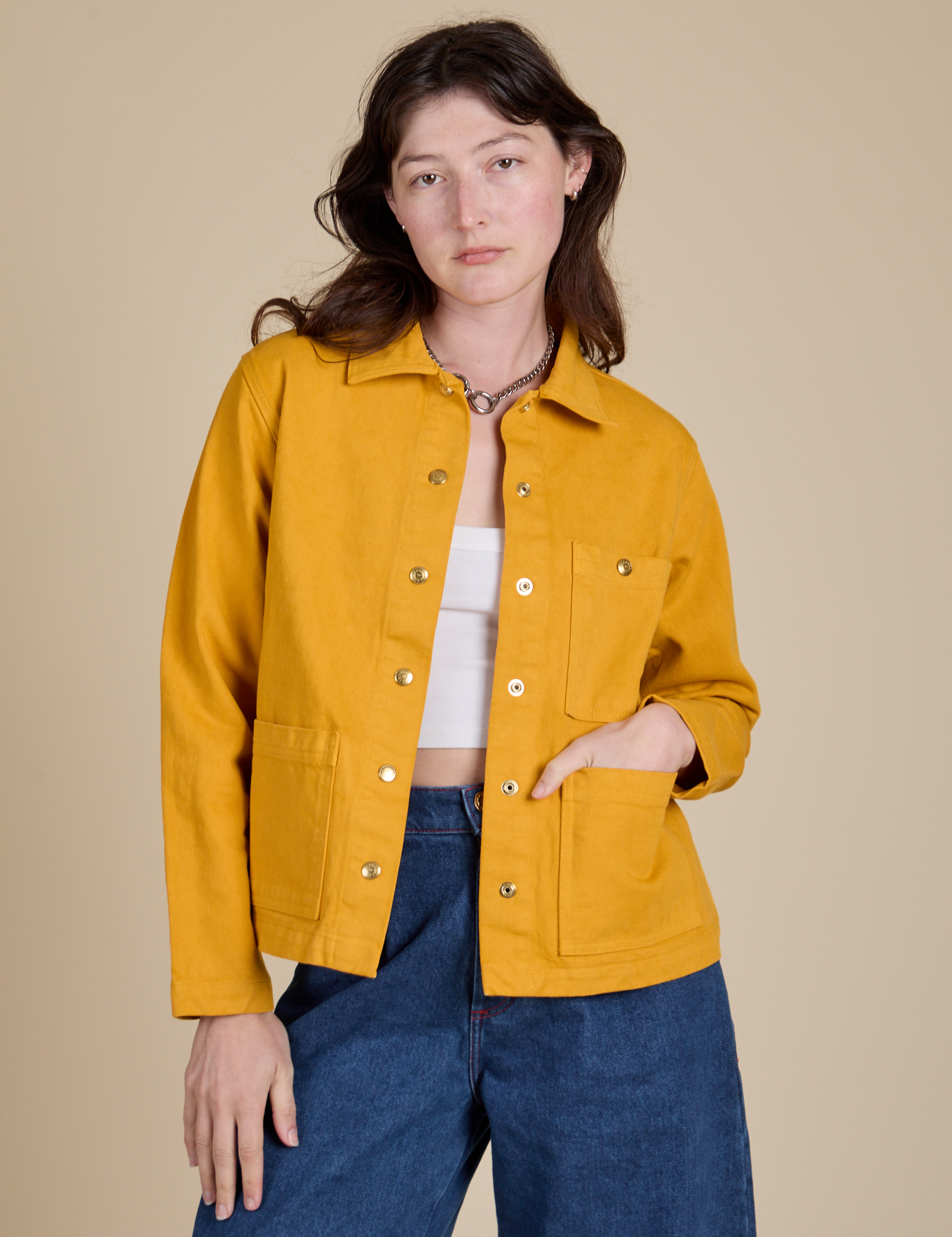 Alex is 5'8" and wearing P Denim Work Jacket in Mustard Yellow