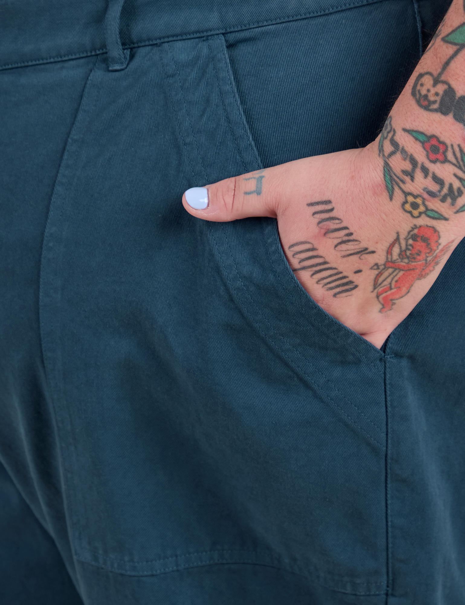 Close up of Sam's hand in the front pocket of Work Pants in Lagoon