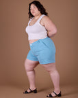 Side view of Classic Work Shorts in Baby Blue and vintage off white Cropped Tank