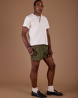 Angled front view of Classic Work Shorts in Surplus Green and Organic Vintage Tee in Vintage Off White on Jerrod