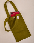 Phone tucked into olive green Cell Phone Tote