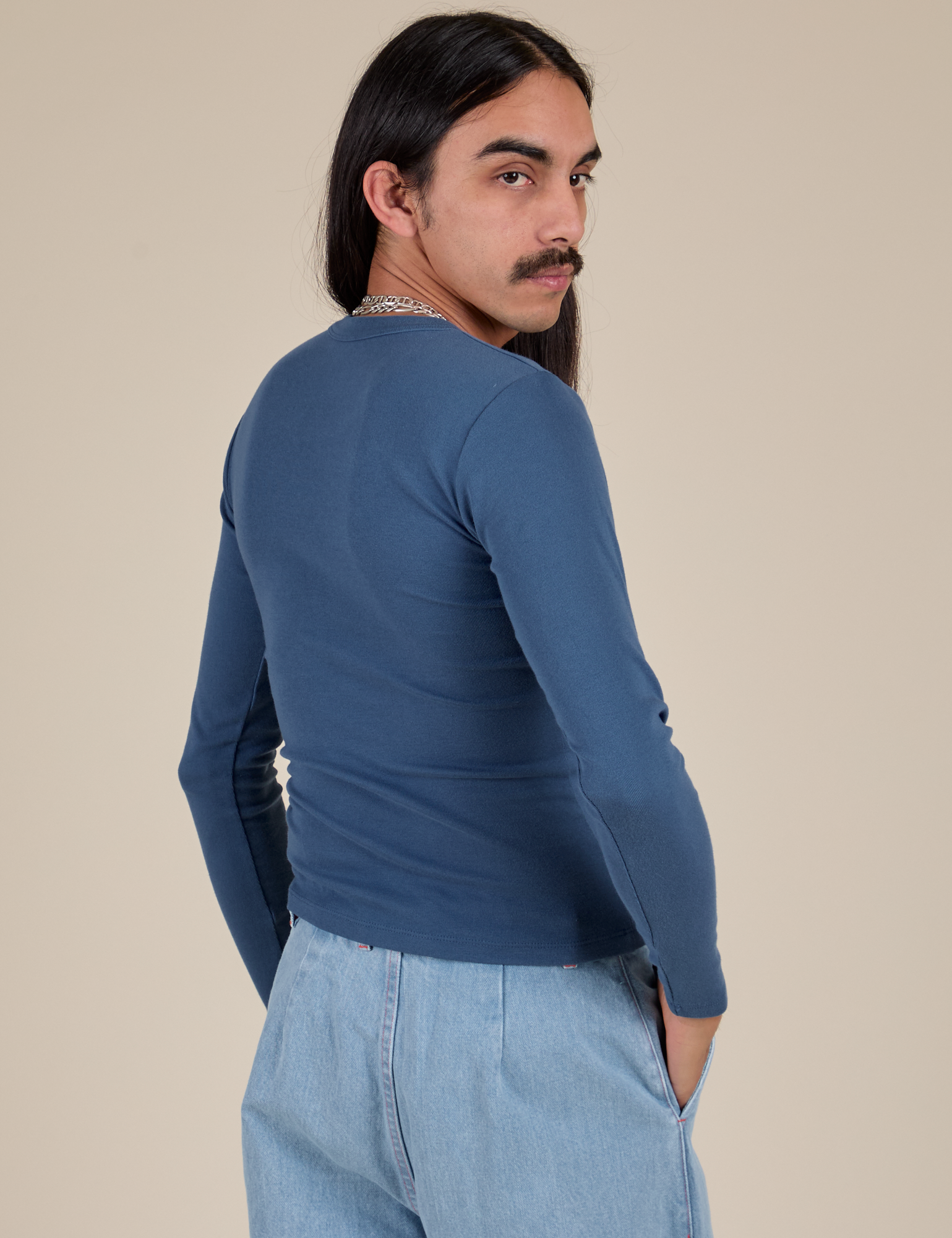 Long Sleeve Baby Tee in French Blue angled back view on Anthony