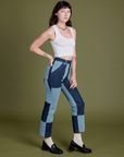 Angled front view of Mismatched Denim Carpenter Jeans and Cropped Tank in Vintage Tee White on Alex