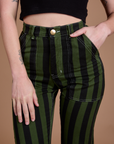 Close up of Alex's hand in the front pocket of Black Stripe Work Pants in Evergreen
