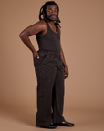 Angled front view of Work Pants in Espresso Brown and matching Tank Top on Demi