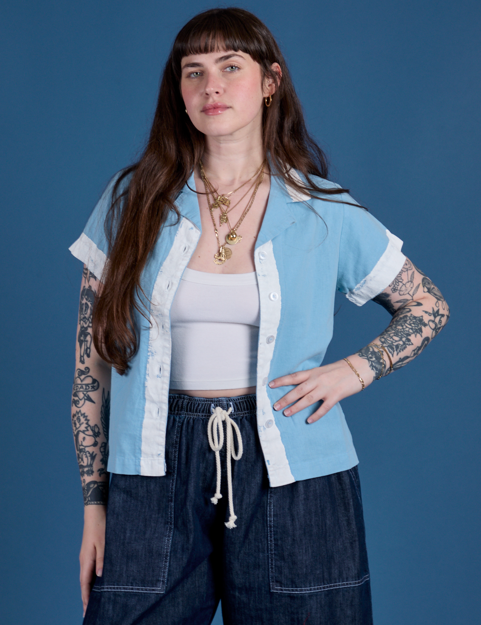 Sydney is 5’9” and wearing XXS Painted Pantry Button-Up in Baby Blue