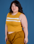 Painted Muscle Tee in Mustard Yellow angled front view on Ashley