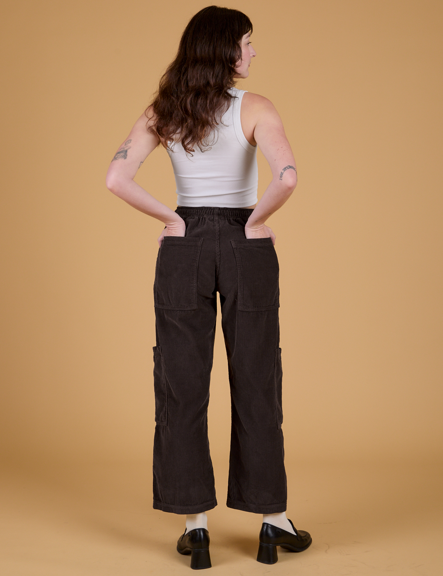 Corduroy Drop Pocket Cargo Pants in Espresso Brown back view on Alex