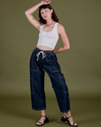 Alex is wearing Denim Drop Pocket Pants in Dark Wash and Cropped Tank in Vintage Tee White
