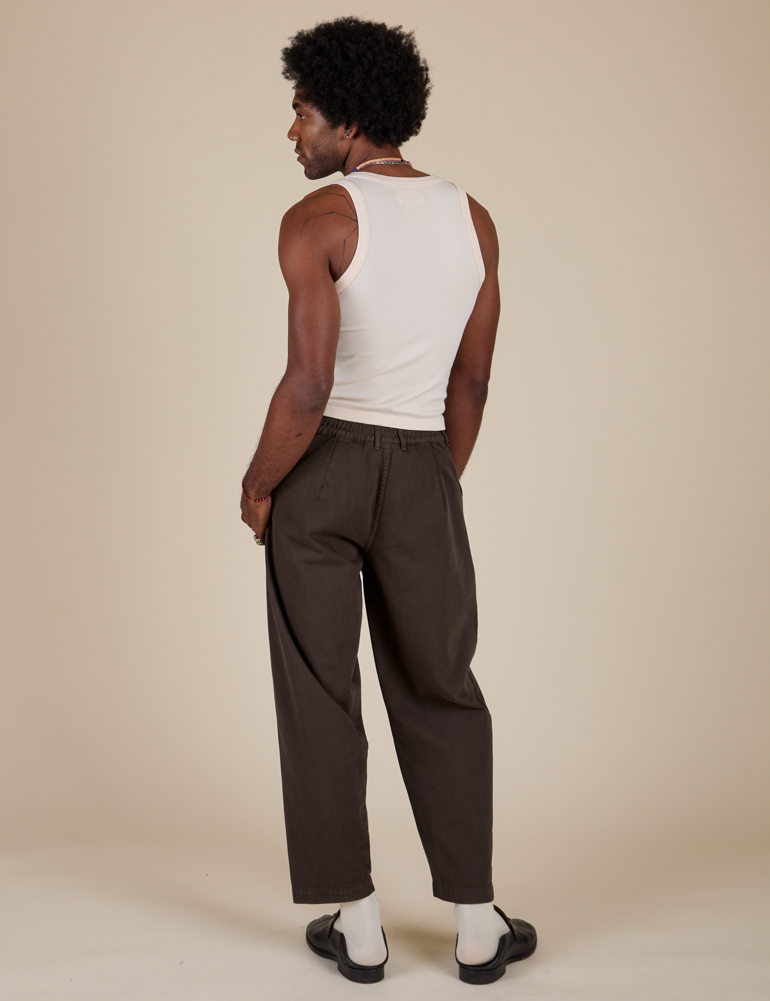 Back view of Heavyweight Trousers in Espresso Brown and Tank Top in Vintage Tee Off-White on Jerrod