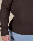 Long Sleeve Baby Tee in Espresso Brown bottom and sleeve close up on Sam