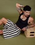 Jesse is wearing Longline Work Shorts in Natural and black Cropped Tank