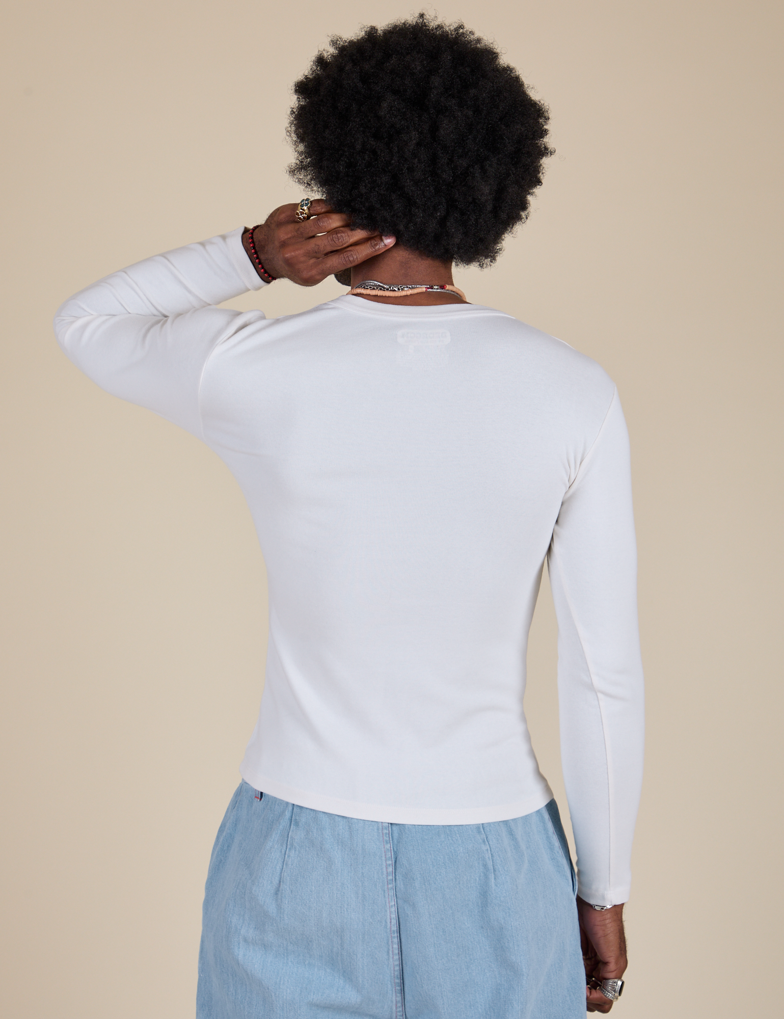 Long Sleeve Baby Tee in Vintage Tee Off-White back view on Jerrod