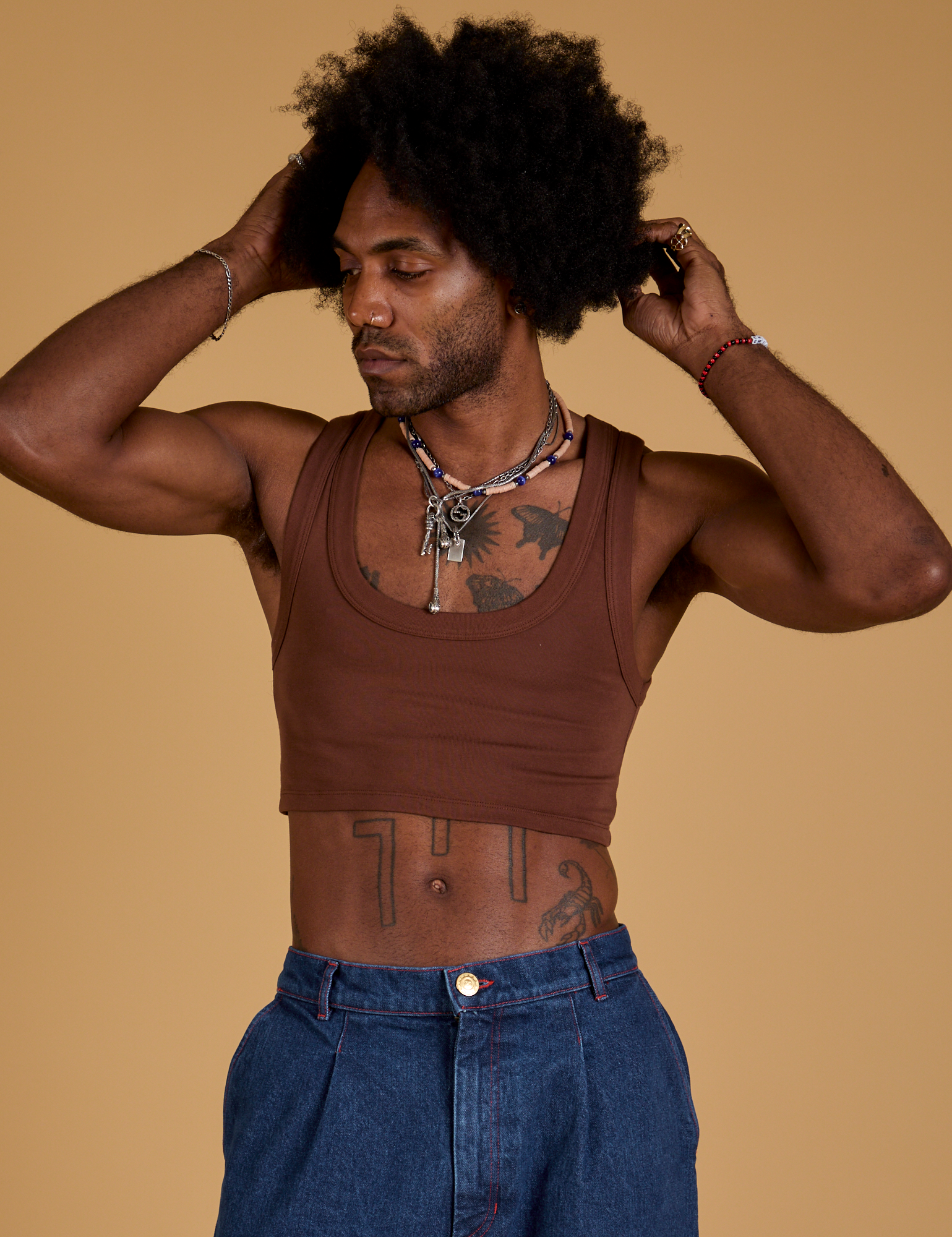 Jerrod is wearing Mini Tank in Fudgesicle Brown