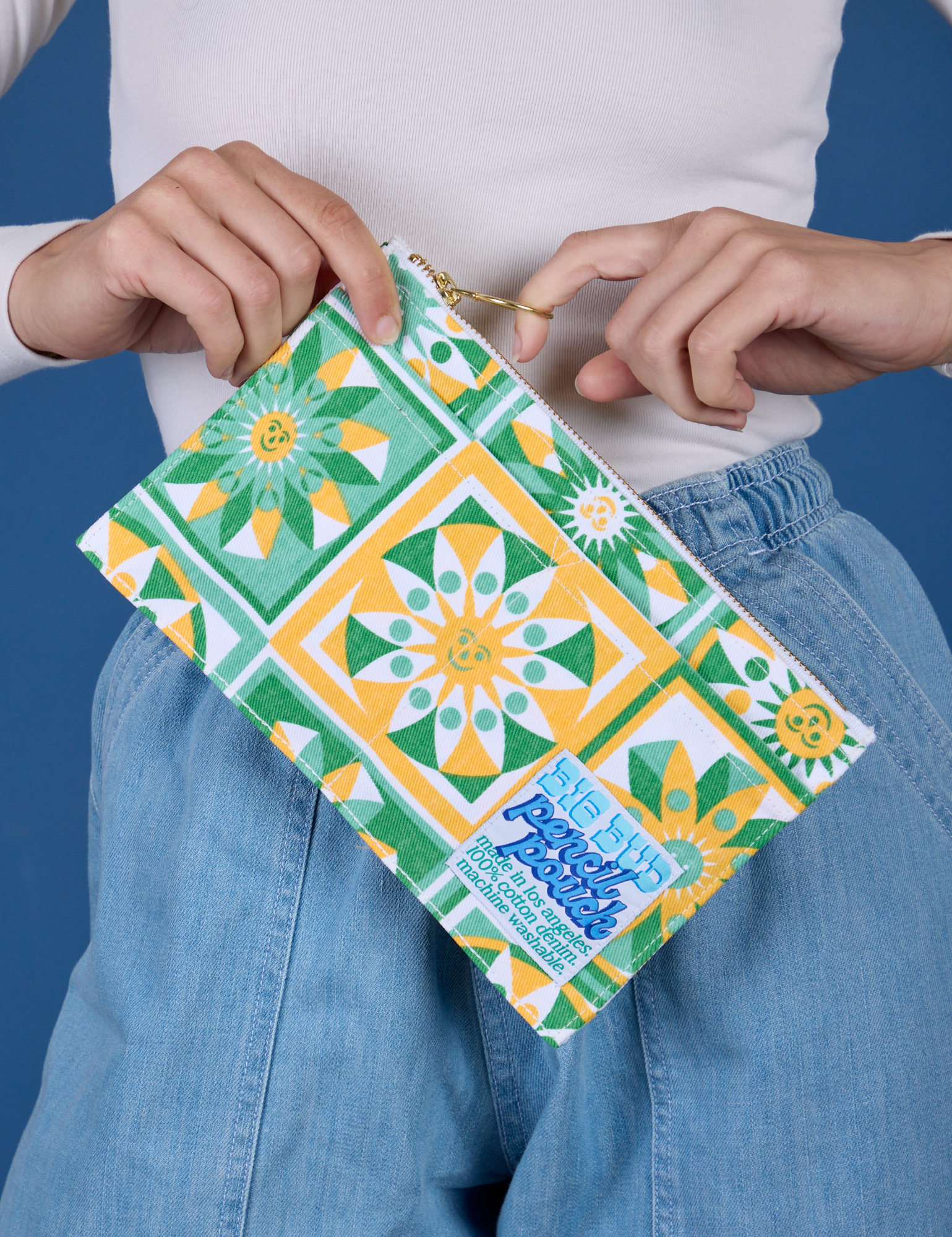 Model is holding the Spring Quilt Printed Pencil Pouch
