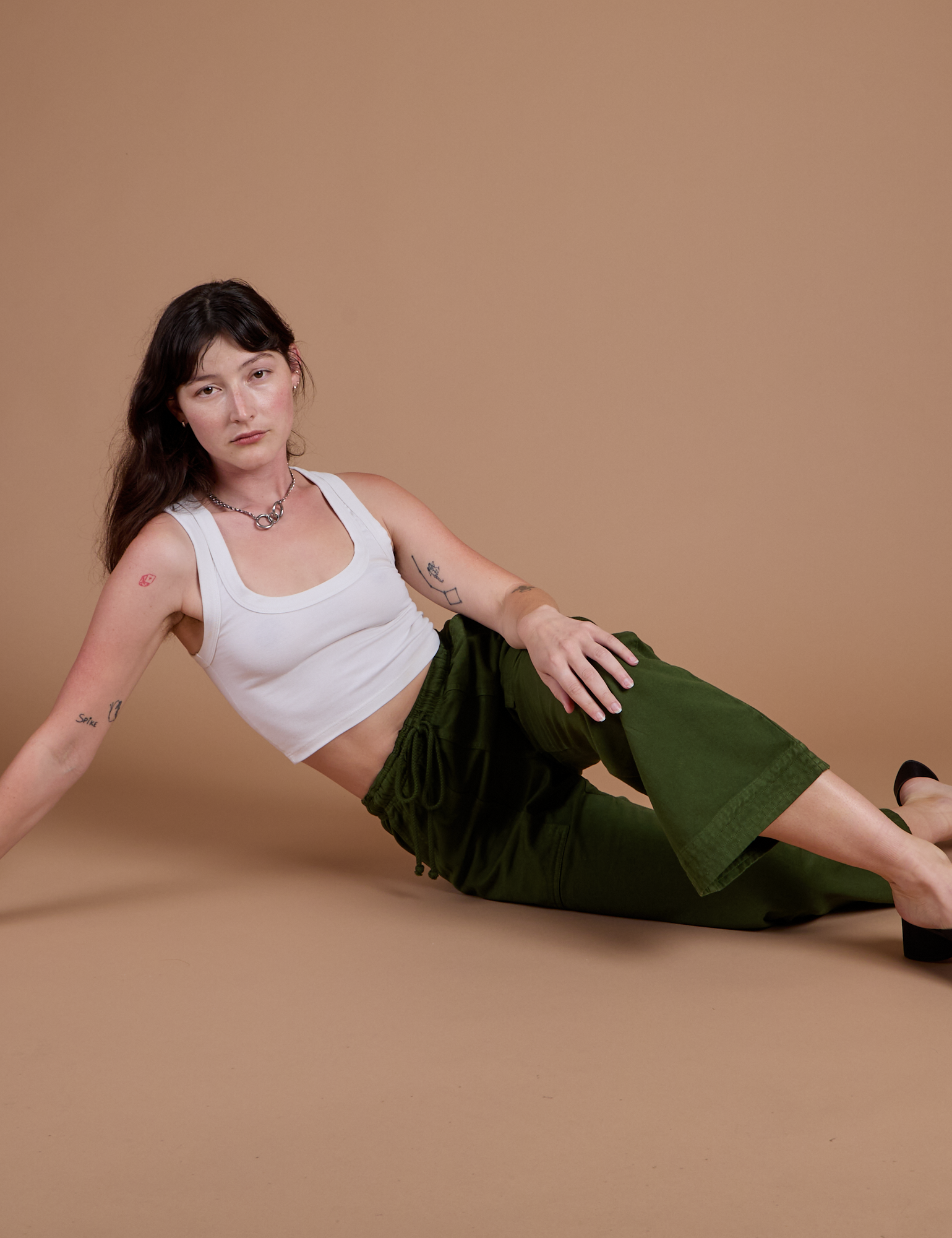 Organic Action Pants in Evergreen and vintage tee white Cropped Tank worn by Alex
