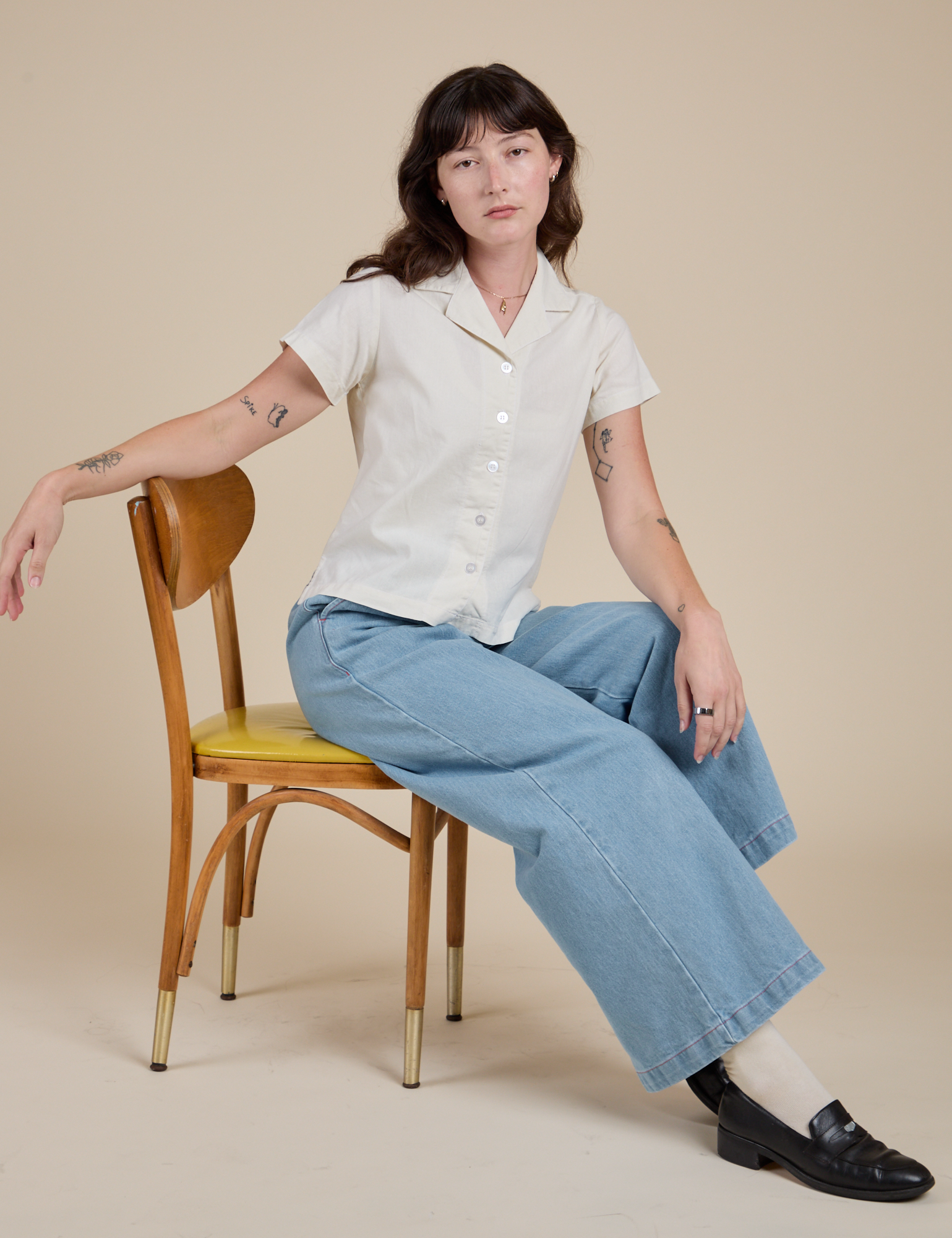 Alex is wearing Pantry Button-Up in Vintage Tee White and Indigo Wide Leg Trousers in Light Wash