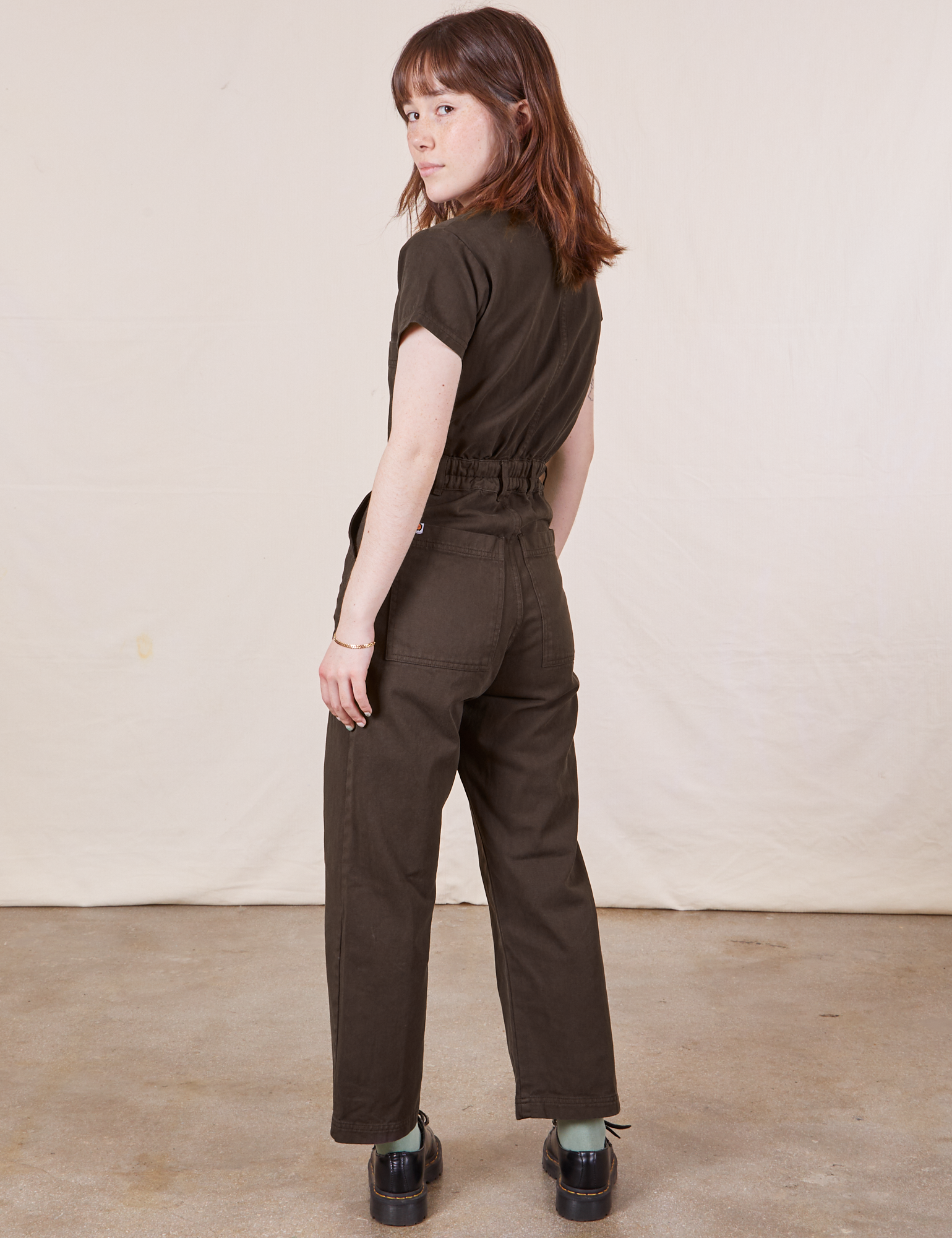 Petite Short Sleeve Jumpsuit in Espresso Brown back view on Hana