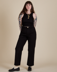Sydney is wearing Racerback Tank in Black and Work Pants in Black
