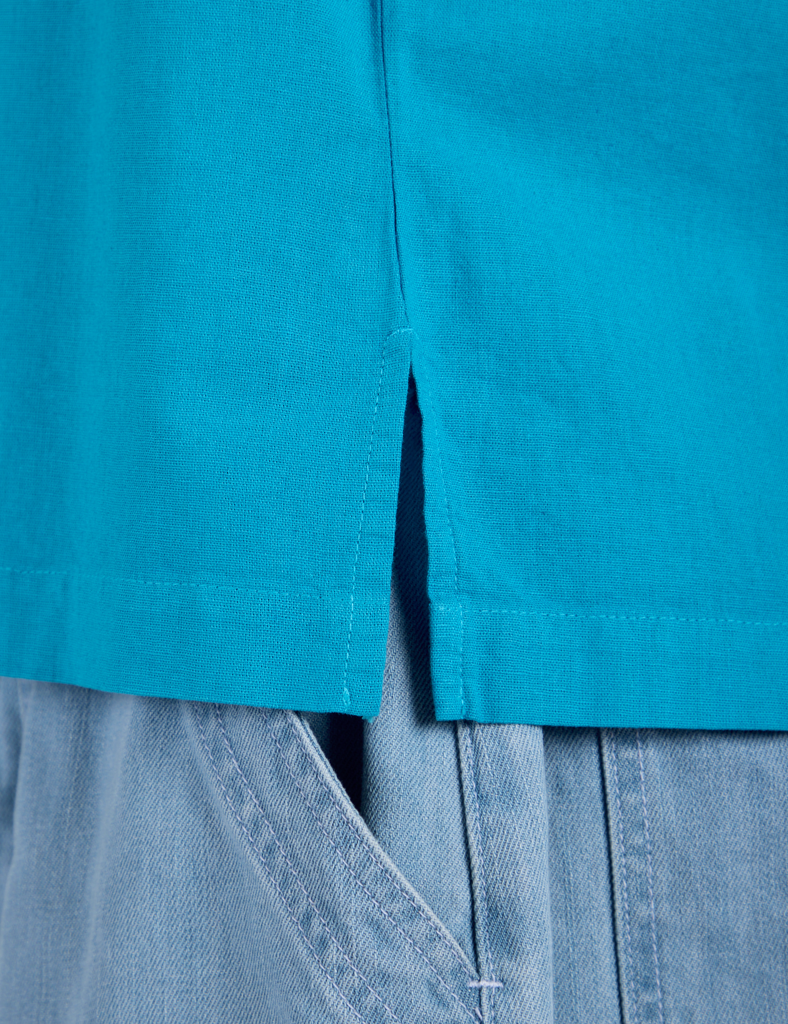 Close up of Pantry Button-Up in Hawaiian Blue side vent