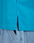 Close up of Pantry Button-Up in Hawaiian Blue side vent