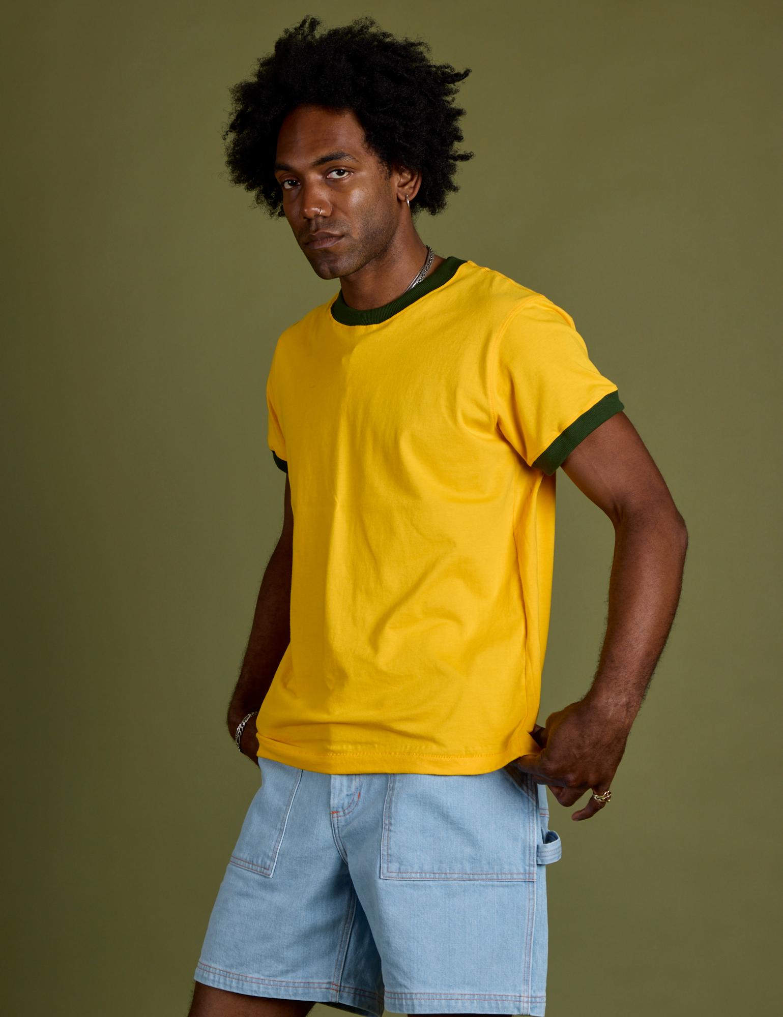 Angled front view of Vintage Ringer Tee in Sunshine Yellow on Jerrod