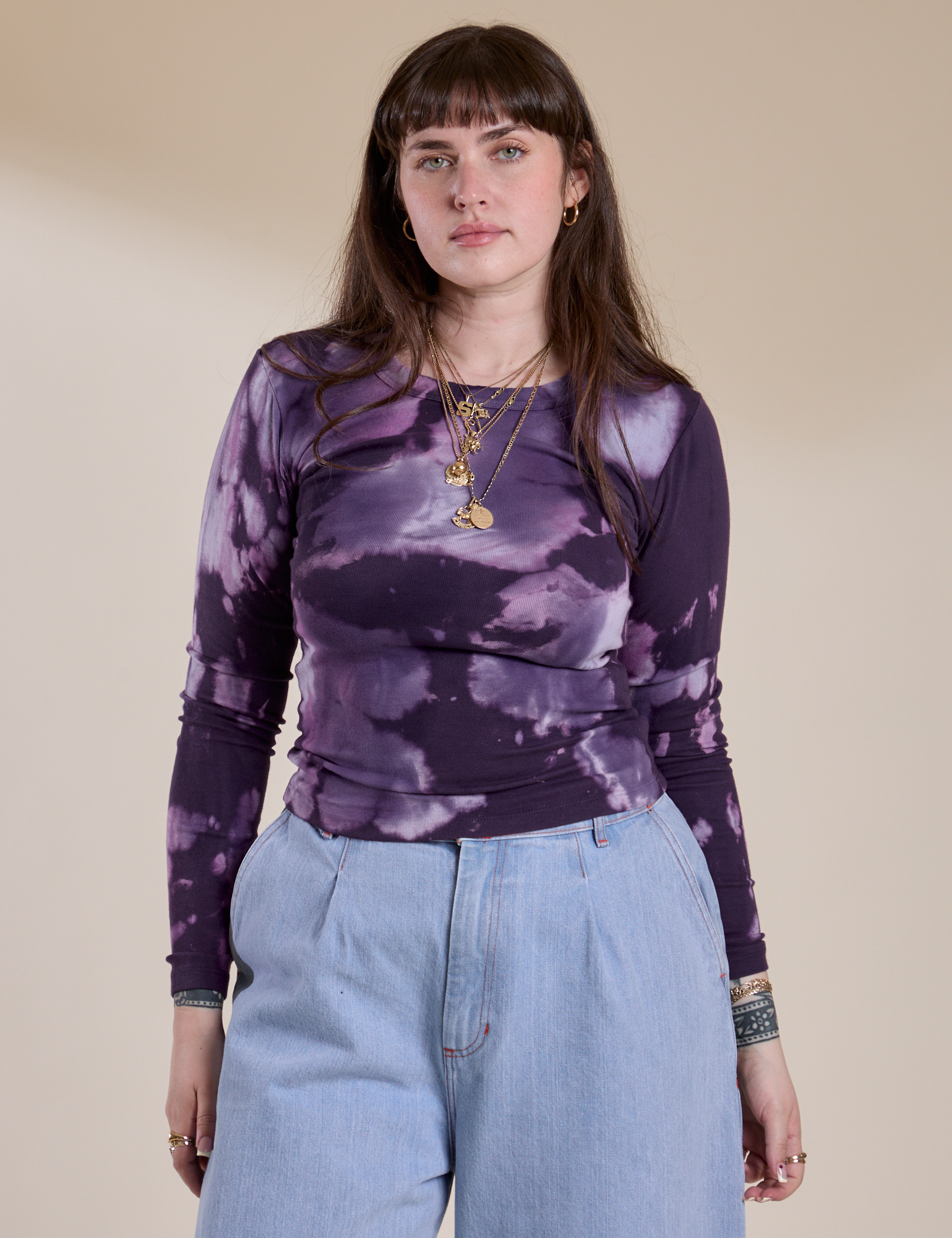 Sydney is 5'9" and wearing XXS Long Sleeve Baby Tee in Dark Lavender